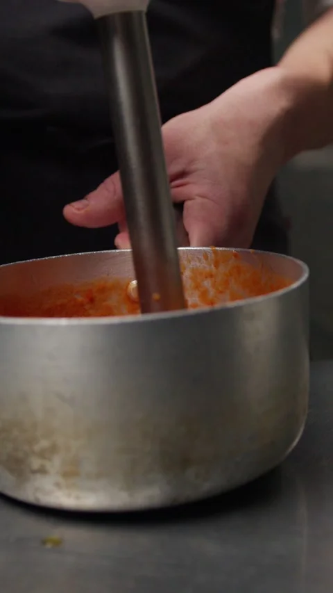 Using Tools In A Kitchen To Create Tomato Cream Stock Footage 276240471