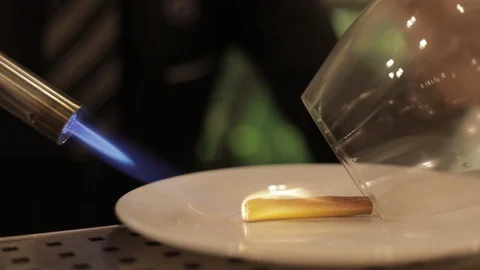 Using Torch to Burn Cinnamon and Make Flavored Smoke Stock Footage 129782449