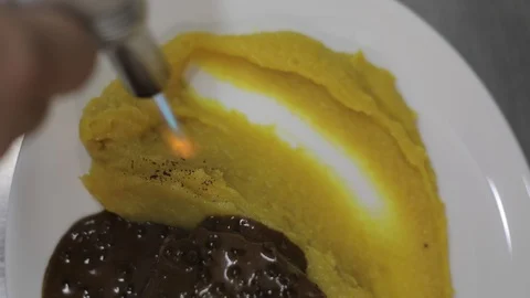 Using a Torch to Decorate a Puree Stock Footage 129340791