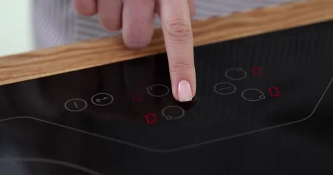 Using a touch screen cooker to set a timer Stock Footage 283526568