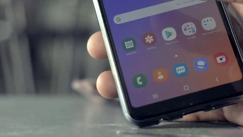 Using a touch screen smartphone to access the web before scrolling down in Stock Footage 120645330