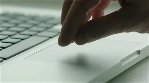 Using the Touchpad and Keyboard of Laptop Stock Footage 60384370