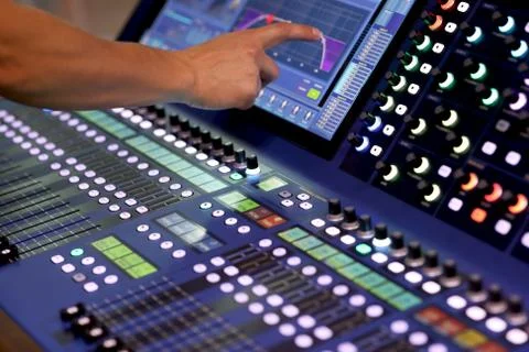 Using touchscreen to control mixing console Stock Photos