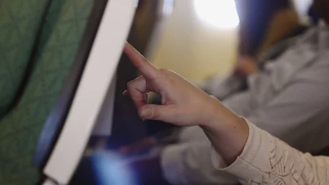 Using of a touchscreen display in an airplane Stock Footage 75005770