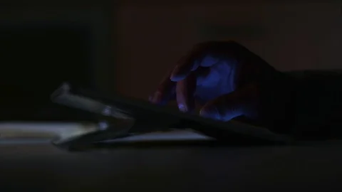 Using touchscreen at night Stock Footage 93623032