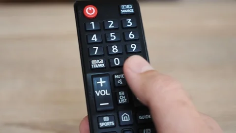 Using the tv remote close up Stock Footage 106028625