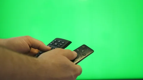 Using two remote controls over green screen simultaneously Stock Footage 129350925