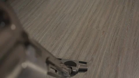 Using a vacuum cleaner to tidy up a laminate floor. A dark-colored laminate Stockbeeldmateriaal 307000904