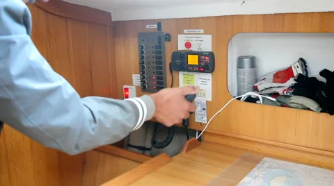 Using a VHF radio on a boat Stockbeeldmateriaal 41262161