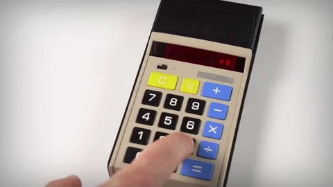 Using a vintage electronic calculator Stock Footage 132600294