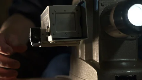 Using a vintage manual slide projector Stock Footage 108488324