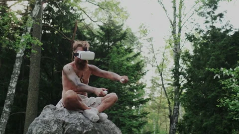 Using Virtual Reality Goggles. Prehistoric Aboriginal Gesturing with Game Stock Footage 130905609