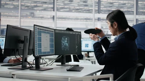 Using VR glasses, microchip circuit layout and engineer in RD office Stock Footage 335881910