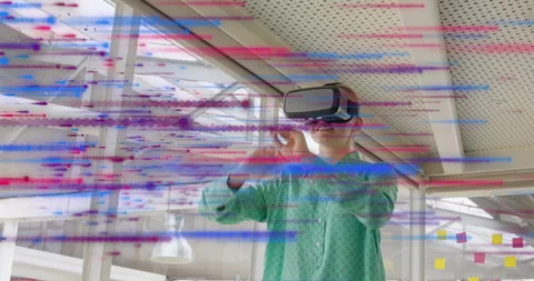 Using VR headset, person experiencing colorful animation in modern school space 库存影片 303647690