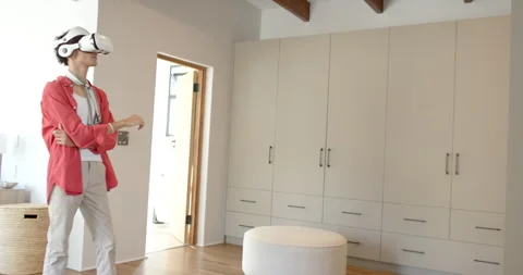 Using VR headset, teenage boy exploring virtual reality experience at home, copy Stock Footage 297527799
