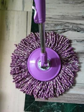 Using of wet mop to clean the floor. Stock Photos