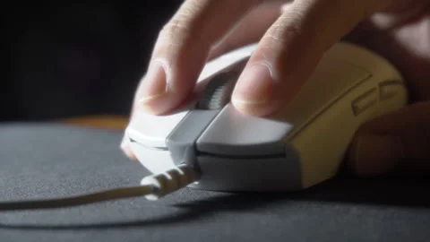 Using wired computer mouse on mousepad Stock Footage 284806983