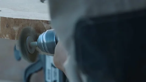 Using a wood processing tool to shave off excess material from the timber item Stock Footage 220475629