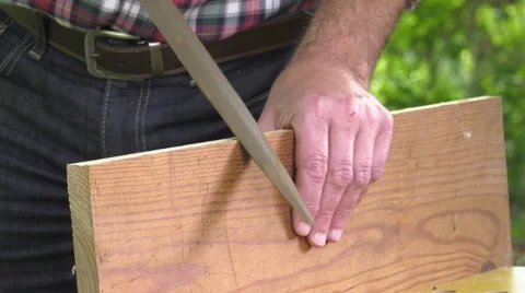 Using a wood rasp on the edge of a board Video stock 63506420