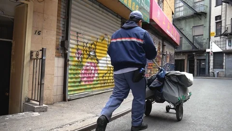 USPS Mail Man Walking Through Chinatown During NYC Lockdown Video stock 128936143