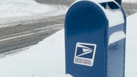 USPS Postal Mailbox is covered in snow during a snowstorm in Bethel Connecticut. Stock Footage 145434847