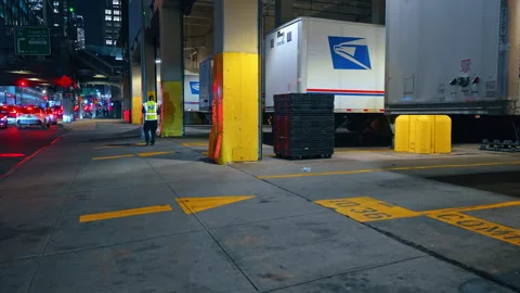 USPS Worker at Night Truck Loading Dock Midtown Manhattan Stock Footage 335415895