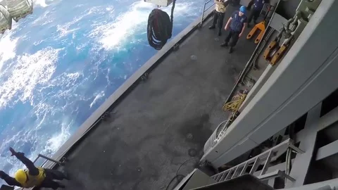 USS Bataan (LHD 5) performs a replenishment-at-sea with USNS Laramie (T-AO 203) Stock Footage 75987429