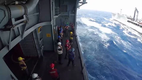 USS Bataan performs a connected replenishment at sea with USNS Laramie - 2017 Stock Footage 87706674