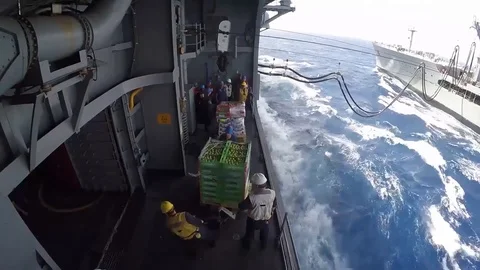 USS Bataan performs a connected replenishment at sea with USNS Laramie - 2017 Stock Footage 87706760