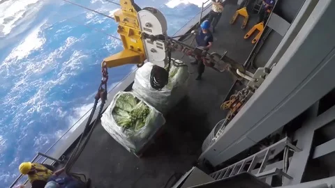 USS Bataan performs a connected replenishment at sea with USNS Laramie - 2017 Stock Footage 87706791