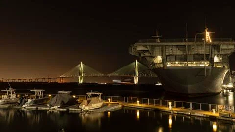 USS Yorktown at night with Cooper river bridge in background Stock Photos