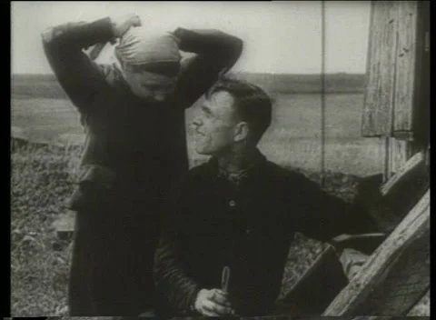 USSR 1930s: Soviet Man and Woman Looking in Mirror Outdoors Stock Footage 334880170