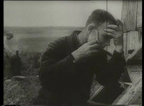 USSR 1930s: Soviet Rural Man Shaving With Straight Razor Outdoors Stock Footage 334879792