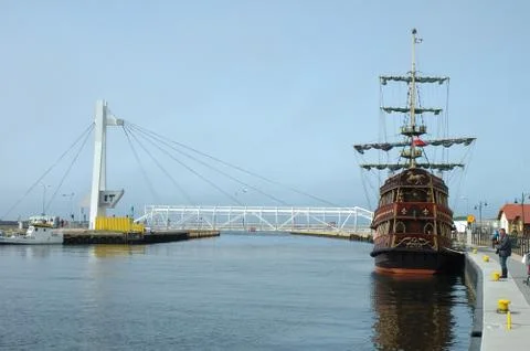 Ustka, Poland - May 24, 2014: Old sailing vessel, drawbridge and unidentified Stock Photos