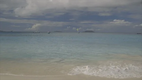 USVI St John Distant Catamaran with Colorful Sails on Ocean 스톡 동영상 123667079