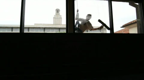 UT Clock Tower Window Cleaner Stock Footage 713251