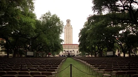 UT Tower with graduation ceremony prep - Austin Texas Stock Footage 82851213