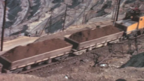Utah - 1965: train brings copper in wagons outside Bingham canyon mine Stock Footage 233450405