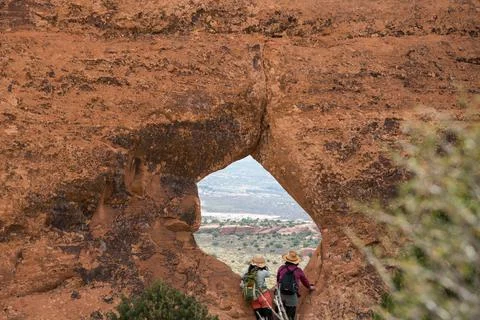 Utah couple looking through window at Arches National Park Stock Photos