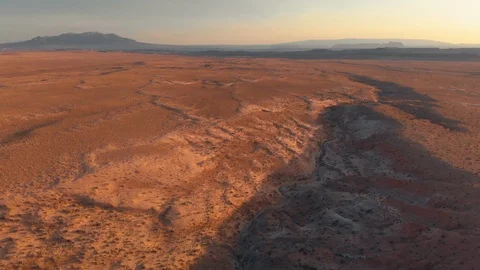 Utah - Flying Back in Desert at Sunset Before Tilt Down to Bluff 動画素材 96086537