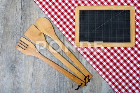 Utensils For Cooking Wood With A Small Blackboard