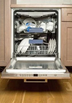 Utensils in dishwasher Stock Photos