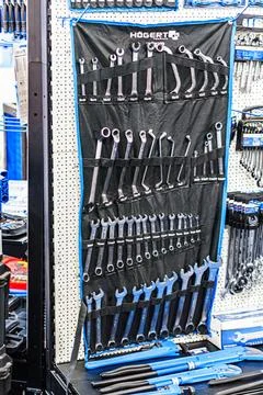 Utilitarian pegboard with assorted tools neatly arranged, contrasting again.. Stock Photos