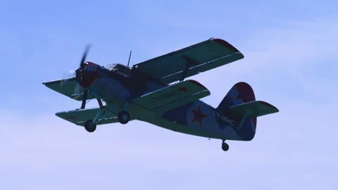 Utility Aircraft Antonov AN-2 Low Angle Fly-By Over Mountain Tracking Shot Stock Footage 332324903