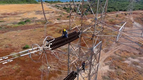 Utility energy sector electricity grid maintenance work high tension power lines Stock Footage 341098158