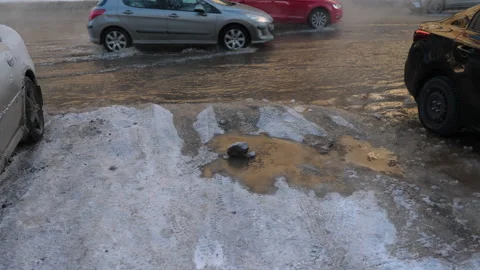Utility failure disaster, street flooded with hot water due to burst pipes .. Stock Footage 258787130