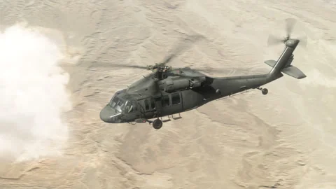 The utility helicopter flies high in the sky. Stock Footage 332483760