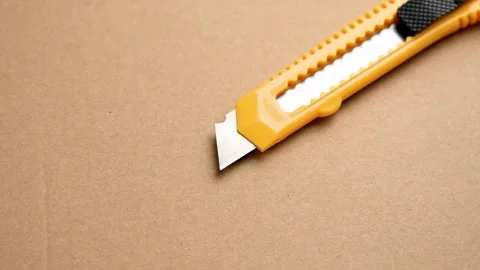 Utility knife or retractable box cutter for parcel unpacking Video stock 262276020