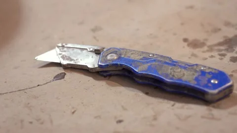 Utility Knife on Workshop Floor Stock Footage 313849754