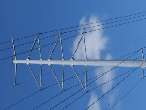 Utility pole across blue sky and clouds Stock-Fotos